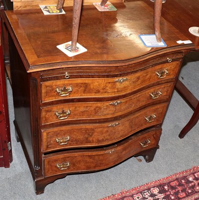 Lot 1338 - A reproduction serpentine walnut chest