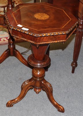 Lot 1346 - A Victorian walnut octagonal shaped work table with hinged lid, 72cm high (restored)