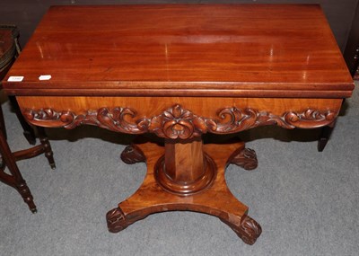 Lot 1348 - An early Victorian carved mahogany fold over tea table, 91cm wide