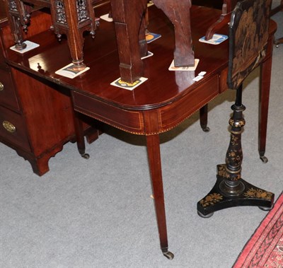 Lot 1361 - A late George III mahogany fold over tea table, 90cm wide