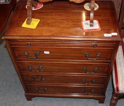 Lot 1362 - A reproduction walnut and crossbanded bachelors chest with brushing slide, 64cm wide