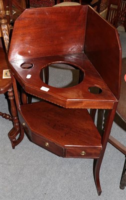 Lot 1365 - A George III mahogany corner washstand, the base with one real and two sham drawers