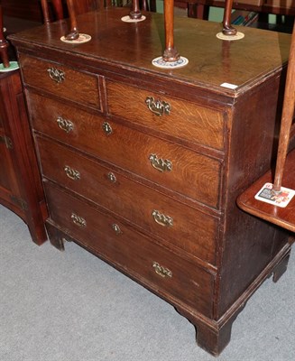 Lot 1372 - George II oak five drawer straight fronted chest of drawers