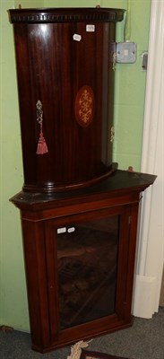 Lot 1379 - A small mahogany bow fronted hanging corner cupboard with decorative brass hinges; and a late...