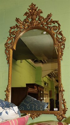 Lot 1382 - A reproduction gilt framed mirror, 140cm high