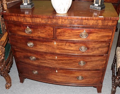 Lot 1392 - A late George III mahogany bow front chest of drawers