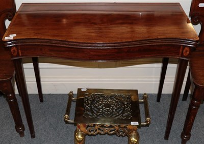 Lot 1405 - A George III mahogany and crossbanded fold over card table, on fluted tapering legs, 91cm wide