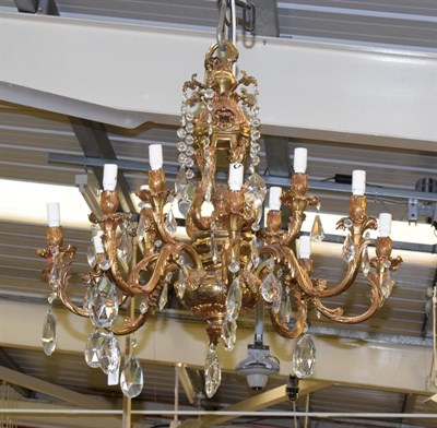 Lot 1407 - An eight branch gilt metal and ormolu chandelier in the Regence style