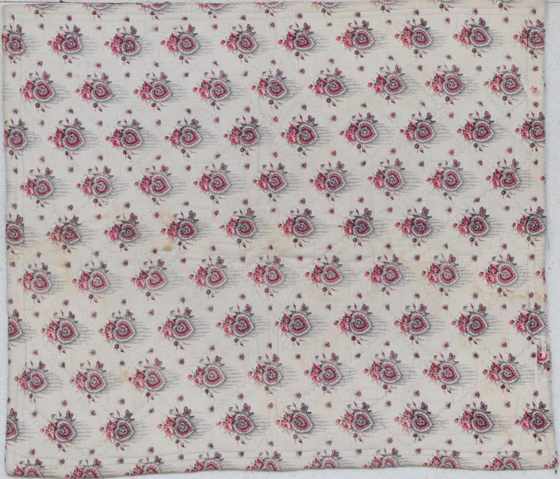 Lot 2015 - Late 19th Century French Wholecloth Crib Quilt, printed with red flowers on a white cotton...