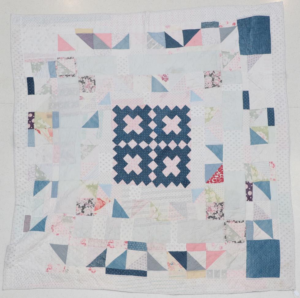 Lot 2024 - Late 19th/Early 20th Century Reversible Patchwork Quilt, with a central square pattern of mid...