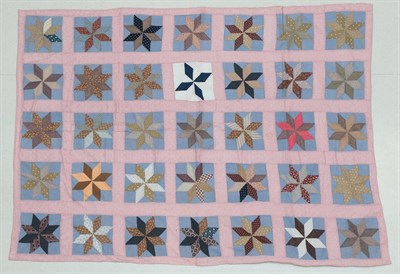 Lot 2026 - Early 20th Century Patchwork Cover, with eight pointed stars incorporating various cotton dress...