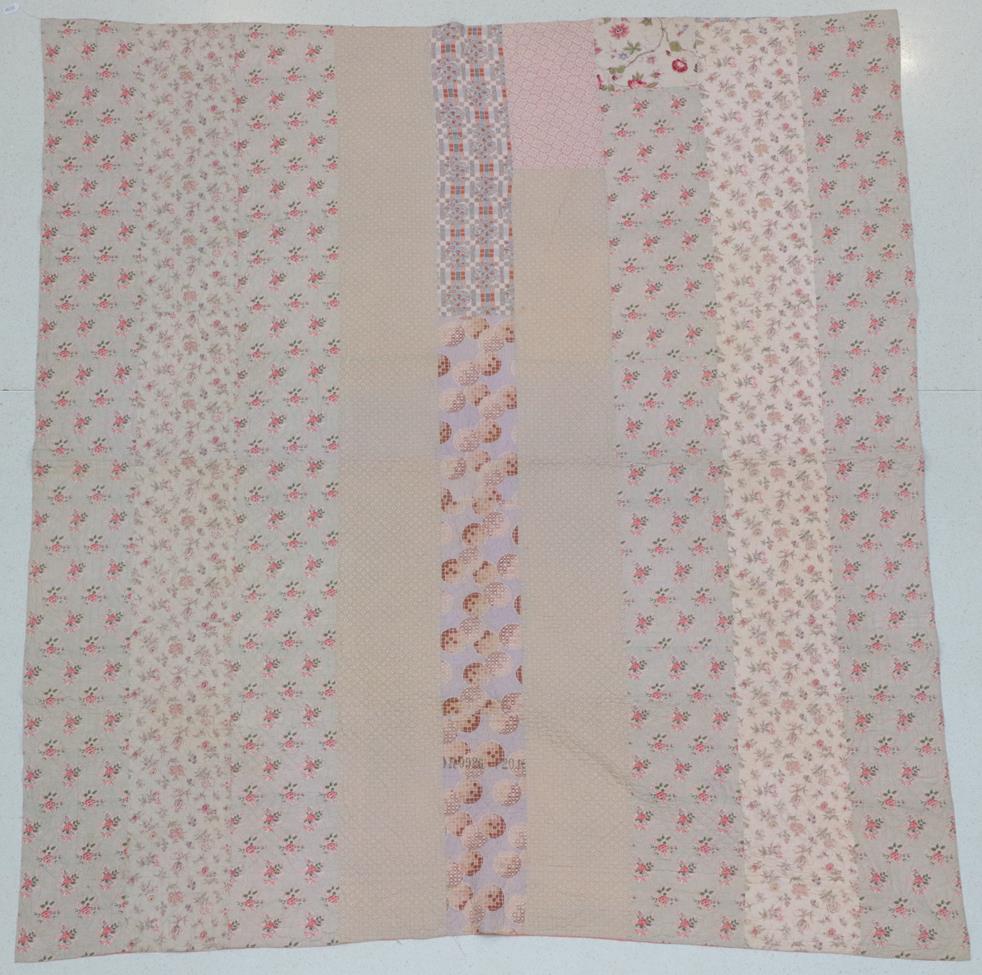 Lot 2036 - Circa 1880 Large Durham Whole Cloth Strippy Quilt, incorporating cream and pink floral fabric...
