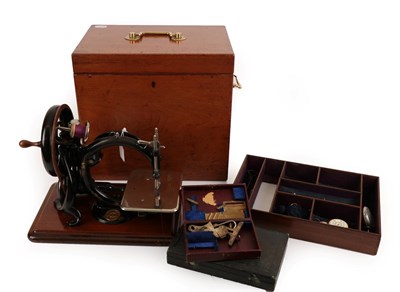 Lot 2065 - 1877 Willcox & Gibbs Sewing Machine, together with two boxes of accessories, in a fitted...