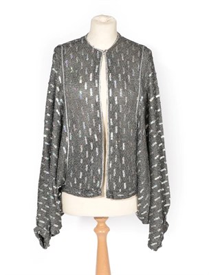 Lot 2217 - Circa 1970's Bill Gibb Silver Knitted Batwing Long Sleeve Cardigan, appliqué with silver...