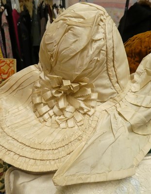 Lot 2221 - Circa 1820 Girls' Cream Silk Evening Bonnet, with a pleated 'bavolet' silk trim to the reverse...