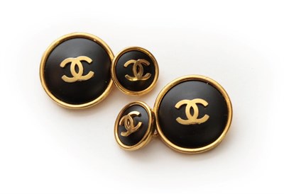 Lot 2271 - Pair of Chanel Cufflinks, in matte black with gilt metal surround, each mounted with...