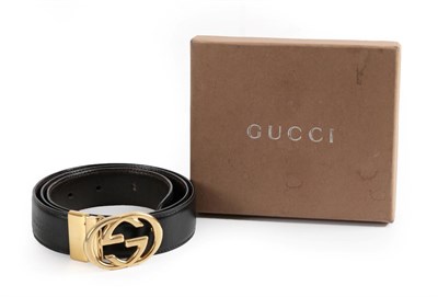 Lot 2288 - Gucci Black Leather Belt, with gilt metal interlocking GG buckle (marked size '80.32', total length