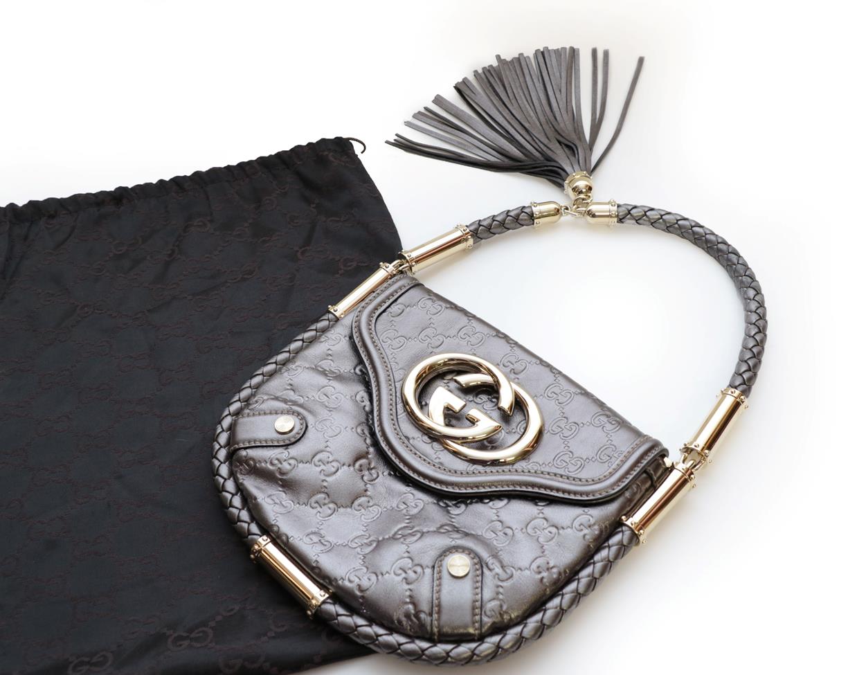 Lot 2305 - Gucci 'Britt Silver Guccissima' Leather Handbag, in metallic silver coloured leather, with...