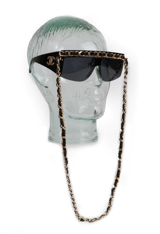 Lot 2307 - Chanel Black Visor Sunglasses, Circa 1990's, each side mounted with gilt metal interlocking...