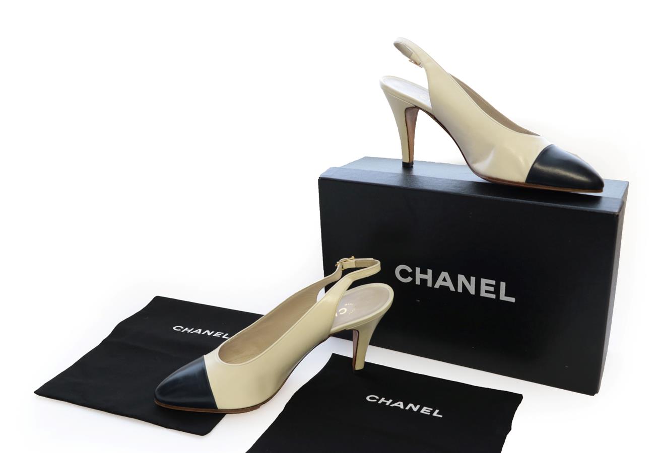 Lot 2308 - Pair of Chanel Cream Leather Sling-Back Heeled Shoes, with navy toe caps (size 5), with box and...