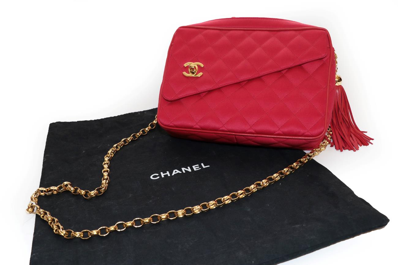 Lot 2320 - Chanel Red Silk Quilted Handbag, Circa 1991-1994, piped in red leather, the asymmetric slant...