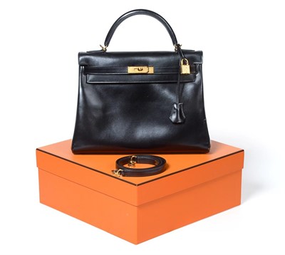 Lot 2322 - Hermès 'Kelly' Black Leather Handbag, 2008, with double strap closure of twist lock, with...