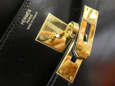 Lot 2322 - Hermès 'Kelly' Black Leather Handbag, 2008, with double strap closure of twist lock, with...