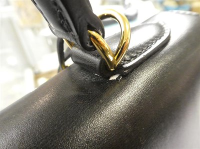 Lot 2322 - Hermès 'Kelly' Black Leather Handbag, 2008, with double strap closure of twist lock, with...