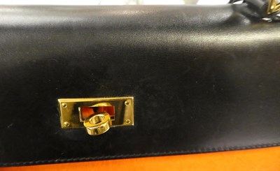 Lot 2322 - Hermès 'Kelly' Black Leather Handbag, 2008, with double strap closure of twist lock, with...