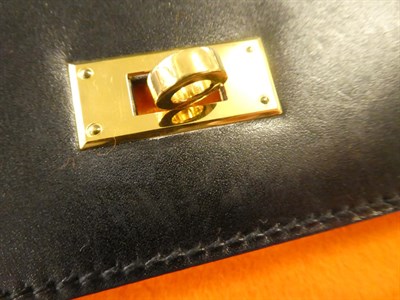 Lot 2322 - Hermès 'Kelly' Black Leather Handbag, 2008, with double strap closure of twist lock, with...