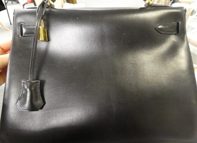 Lot 2322 - Hermès 'Kelly' Black Leather Handbag, 2008, with double strap closure of twist lock, with...