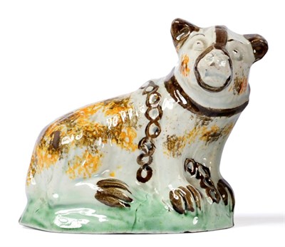 Lot 2 - A Pratt-Type Figure of a Bear, circa 1800, the seated animal with brown and ochre sponged markings
