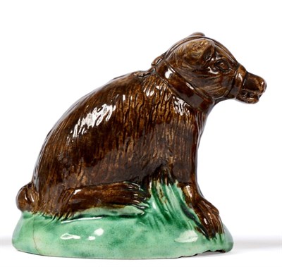 Lot 3 - A Creamware Figure of a Bear, late 18th century, of wood type, the naturalistically modelled...