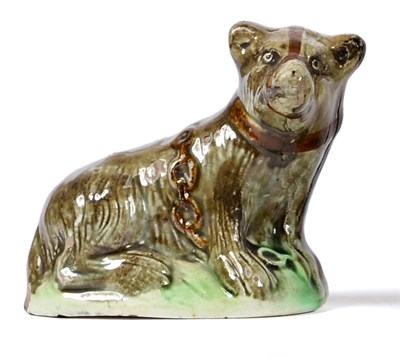 Lot 5 - A Creamware Model of a Bear, late 18th century, the naturalistically modelled animal sitting...