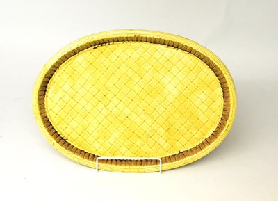 Lot 28 - A Victorian Majolica Oval Basket Moulded Dish, picked out in tortoiseshell glazes, 44cm wide