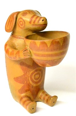 Lot 46 - A Pre-Columbian Style Glazed Terracotta Figure of a Pig, modern, sitting holding a bowl in its...
