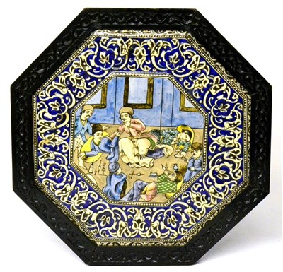 Lot 47 - A Qajar Pottery Octagonal Plaque, early 20th century, the central panel painted with an erotic...