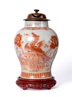 Lot 58 - A Chinese Porcelain Baluster Jar, 18th century, painted in iron red with phoenix perched on a...