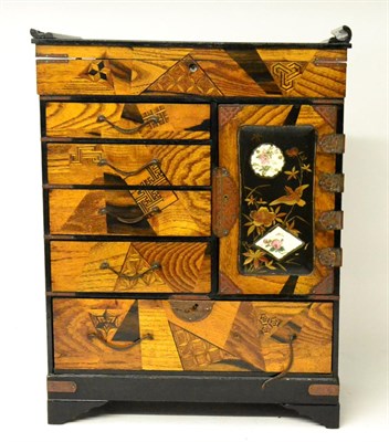 Lot 65 - A Japanese Lacquer Table Cabinet, Meiji period, the hinged top over an arrangement of five drawers