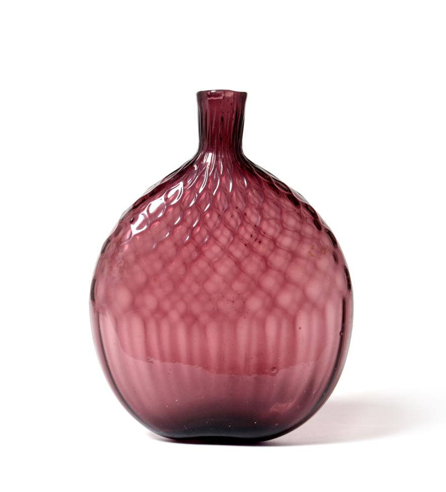 Lot 67 - An Amethyst Glass Flask, circa 1800, of flattened circular form with honeycomb moulding, 16.5cm...