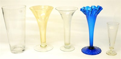 Lot 77 - A Blue Glass Vase, of fluted flared form with frilled rim, 39.5cm high; Two Glass Trumpet...