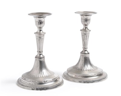 Lot 119 - A Pair of Neo-Classical Candlesticks, probably Thomas Hoare, London 1779, the tapering circular...