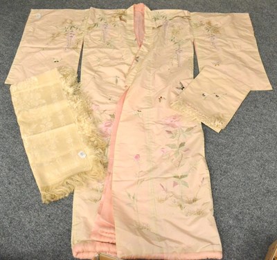 Lot 168 - A 20th Century Oriental Cream Silk Robe embroidered with a crane, with a pink silk lining and sash