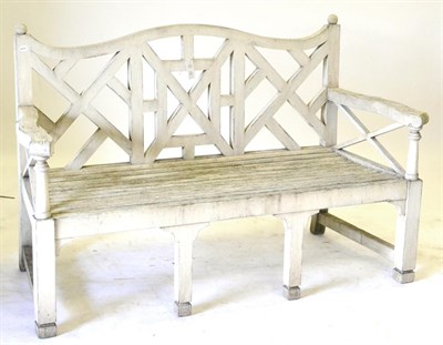 Lot 255 - A White Painted Wooden Garden Bench, with Chinese lattice back, on square legs, 155cm wide...