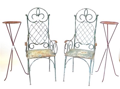 Lot 259 - A Pair of Late 19th Century Green Painted Iron Armchairs, with oval lattice back supports and solid