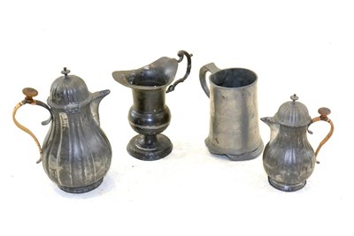 Lot 292 - A German Pewter Coffee Pot and Cover and Milk Jug and Cover, dated 1785, of fluted baluster...