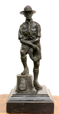 Lot 360 - A Bronze Figure of a Scout, mid 20th century, standing, his feet on a tree stump, on an...