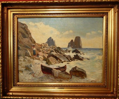 Lot 806 - N...F...Schiottz-Jensen (1855-1941) Danish Coastal scene with a figure and boat beside rocks...