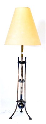 Lot 405 - A Steel Standard Lamp, of cylindrical form flanked by three supports on pierced collars and triform