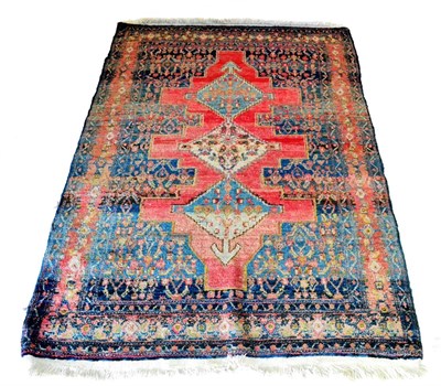 Lot 450 - Senneh Rug Persian Kurdistan The indigo field centred by rose red panels and three stepped...